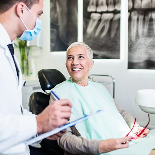 a patient smiling during her dental visit