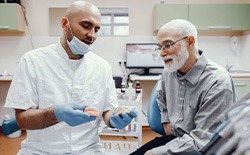 Dentures patient in Lacey talking with dentist