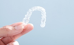 Patient holding clear aligner